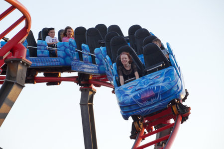Varna, Bulgaria - July, 23, 2022: people emotionally ride a high-speed roller coasterのeditorial素材