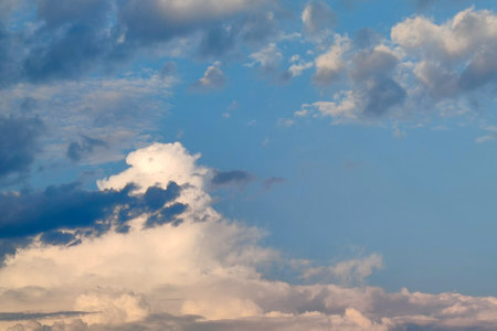 sunny sky is covered with rain clouds, natural blue background.
