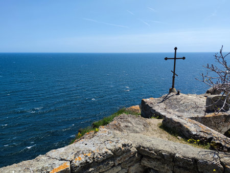 metal cross on top of Cape Kaliakra in Bulgaria against the sea horizon.の写真素材