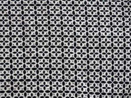 abstract monochrome dot pattern on textile fabric surface.