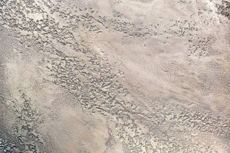 Decorative plaster travertine close-up for gray background.