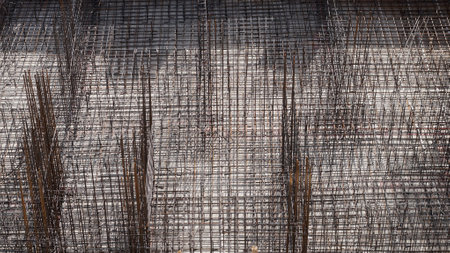 Industrial background. Foundation construction. Tied metal reinforcement before pouring concrete.