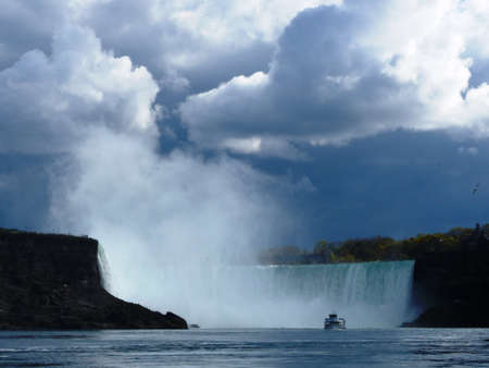 Niagara Falls, Ontario / Canada - May 08 2017: Niagara waterfalls in the afternoon. View from Horn Blower boat on the horseshoe and Maid of the Mist boatのeditorial素材
