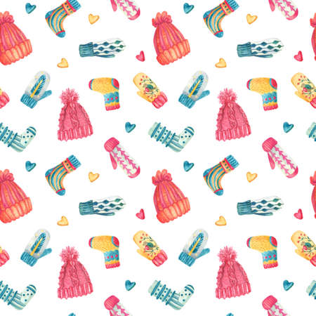 Watercolor seamless pattern with knitted warm clothes. Colorful cute hats, mittens, socks on white. Winter or Christmas textile. Great for kids or baby fabrics, Xmas wrapping papers, covers.の写真素材