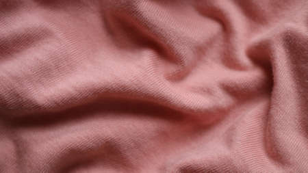pink cotton lined fabric crumpled into three-dimensional embossed design backgroundの写真素材