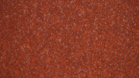 smooth surface of rusted metal sheet with a grainy texture of rusty coating and a beautiful...