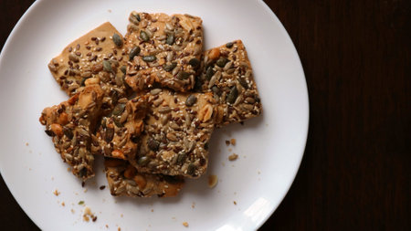crispy crumbly cookies with peanuts and flax, sesame, sunflower and pumpkin seeds on a large white...