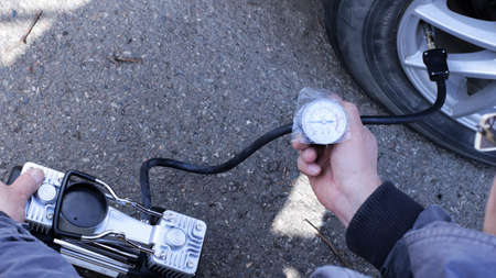 inflating a deflated wheel with an electric pump and monitoring the air pressure in the tires,...