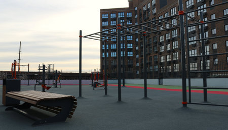 sports ground with exercise machines and benches for sports and recreation in the courtyard of a...