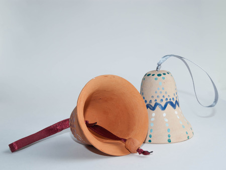 Ceramic handmade painted bells on white backgroundの写真素材