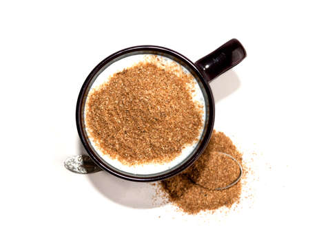 Kefir in red cup and Siberian fiber isolated on white