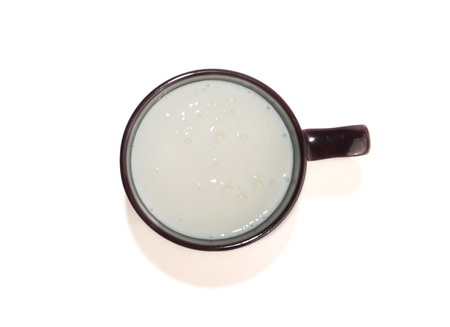 Kefir in cup isolated with shadow on white top viewの写真素材