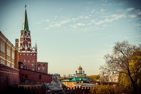 View of the Trinity Tower of the Moscow Kremlin and Christ the Savior Cathedral in Moscow in the summer, Russia, toned image with vignetteの写真素材
