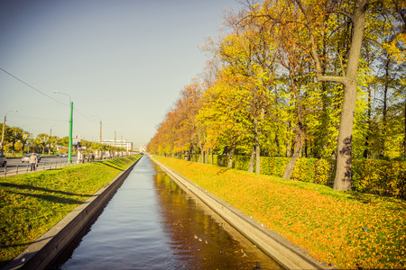 SAINT-PETERSBURG, RUSSIA â OCTOBER  19, 2016: Swan Canal and autumn trees reflected in waterのeditorial素材