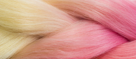 Blond and pink colored hairstyles close-up texture