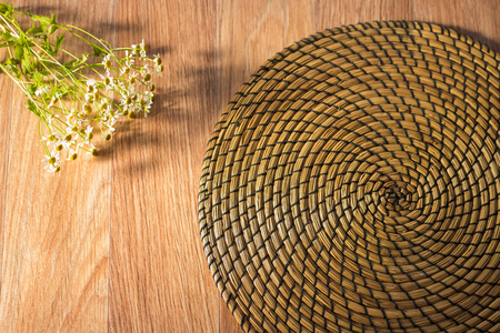 Flat lay toned image of chamomile on straw napkin background shallow depth of fieldの写真素材