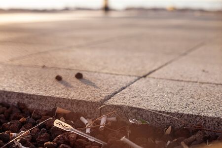 IZMIR, TURKEY, JULY 29, 2019: garbage on the street. Concept of combating environmental problems pollution. Sunset time, close-up, shallow depth of fieldのeditorial素材