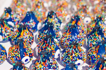 Multicolored nazar - evil eye amulets in store on the street. Close-up, shallow depth of field....