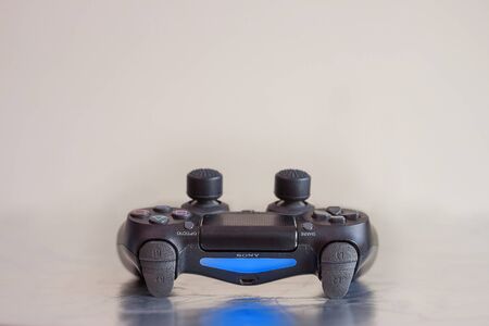 SAINT-PETERSBURG â€“ RUSSIA - JULY 12 2019: Dualshock 4 controller for Sony PlayStation 4 lies...
