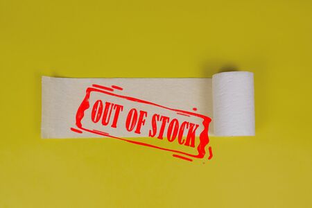 Roll of toilet paper on yellow background. Toilet paper crisis due to coronavirus COVID-19...