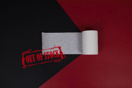 Roll of toilet paper top view and stamp with OUT OF STOCK inscription. Toilet paper crisis due to...