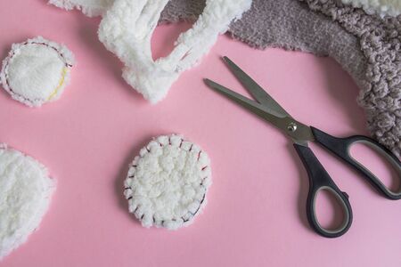 Instructions for step by step creating a do-it-yourself reusable cotton discs. Step 6, finish. Flat lay on pink background. Eco-friendly lifestyle, zero waste concept.の写真素材