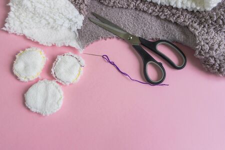 Instructions for step by step creating a do-it-yourself reusable cotton discs. Step 9. Flat lay on pink background. Eco-friendly lifestyle, zero waste concept. Place for textの写真素材