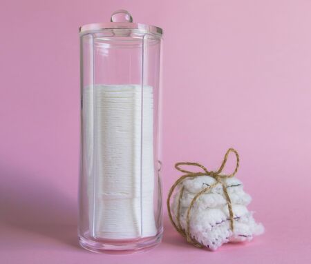 Reusable and disposable cotton discs for face or makeup removal flat lay. Eco-friendly lifestyle, zero waste concept.の写真素材