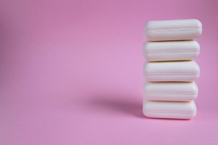Soap on pink background. Picture with selective focus and place for text. Concept of maintaining...