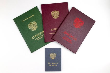 School certificate, Diploma of secondary education and Diploma of higher education in Russia lie over the Employment history book. Life goals and Career Concept. の写真素材