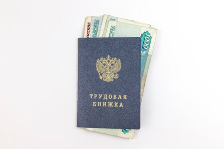 Employment history. On cover text in Russian Labor book. Inside Russian rubles banknotes. の写真素材