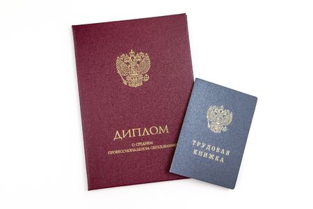 Russian Diploma of secondary education and Employment history book. Applying for work after college concept.の写真素材