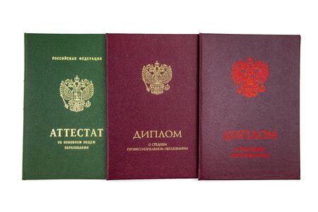 Different education certificates in Russia. School certificate, Diploma of secondary education and Diploma of higher education in Russia. Life goals and learning achievement concept. の写真素材