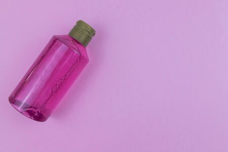 Skin care cosmetics. Facial or body wash gel on pink background with place for text. Selective focusの写真素材