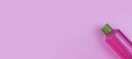 Skin care cosmetics. Facial or body wash gel on pink background with place for text. Selective focus bannerの写真素材