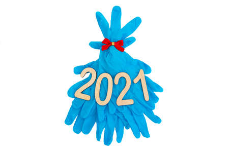Christmas tree made of disposable medical gloves isolated on white. The concept of celebrating the New Year in the context of the covid-19 pandemicの写真素材