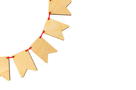 Garland of plywood flags isolated on white background with place for your text. top view shallow depth of fieldの写真素材