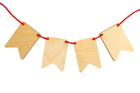 Garland of plywood flags isolated on white background with place for your text. top view shallow depth of fieldの写真素材