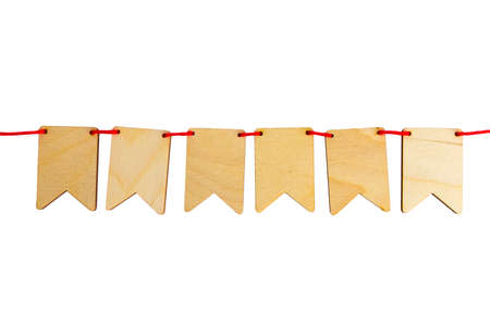 Garland of plywood flags isolated on white background with place for your text. top view shallow depth of fieldの写真素材
