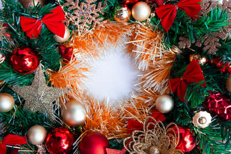 Frame for text made of Christmas wreath. Top view picture with place for text in the middle and shallow depth of fieldの写真素材