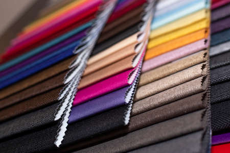 Multicolor upholstery fabric samples close-up shallow depth of field. color selection