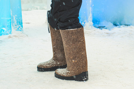 The Snow Village are warm Russian felt boots with rubber soles. Winter frosty day in russia....