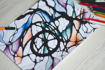 Stock Foto Close-up of neurographics. The Method of Metamodern Art and Psychological Research in Neurographics. Mental health, adult fine motor skills, creativity, psychology. Notepad with a picture.の写真素材