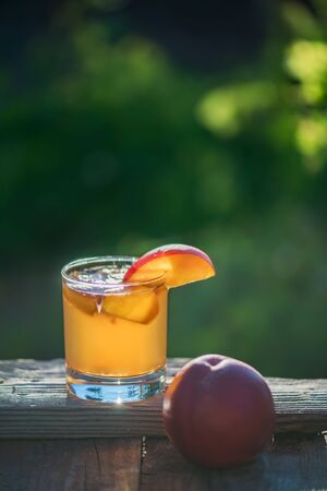 Homemade Fermented Raw Kombucha Tea Ready to Drink With peach. Summer healthy detox beverage in glass. Selective focusの写真素材