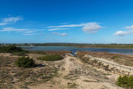 Beautiful view of Salina dei Monaci, the salt lake and natural deposit of salt in the coastal area of Manduria, regione of Puglia, Italyの写真素材