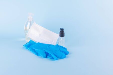 Protective kit for prevention of virus infection, gel hand sanitizer, white surgical mask, blue latex gloves, antibacterical soap. Self igiene concept, protect yourself for coronavirusの写真素材