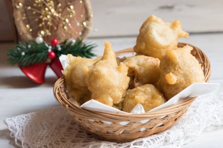 Pettole is a traditional christmas south italian food cooked from dough and fried in olive oil, made in Salento, Apuliaの写真素材
