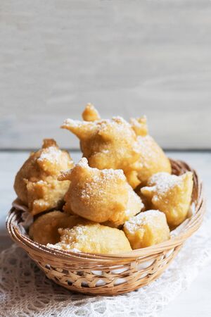 Pettole is a traditional christmas south italian food cooked from dough and fried in olive oil, made in Salento, Apulia, copy spaceの写真素材