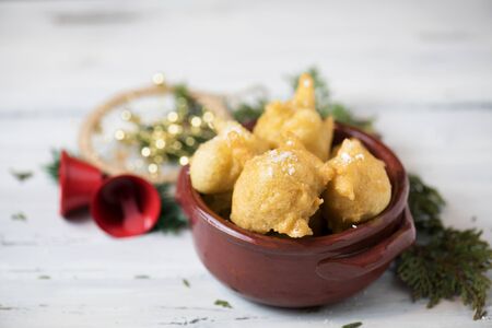 Pettole is a traditional christmas south italian food cooked from dough and fried in olive oil, made in Salento, Apuliaの写真素材