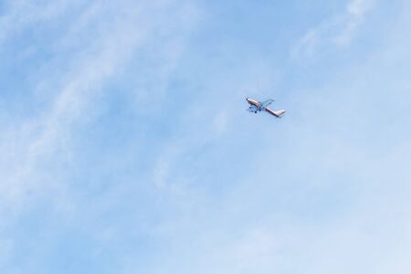 small jet against blue sky and clouds in southen Italy, Salento, region of Puglia, Santa Maria di Leuca cityの写真素材